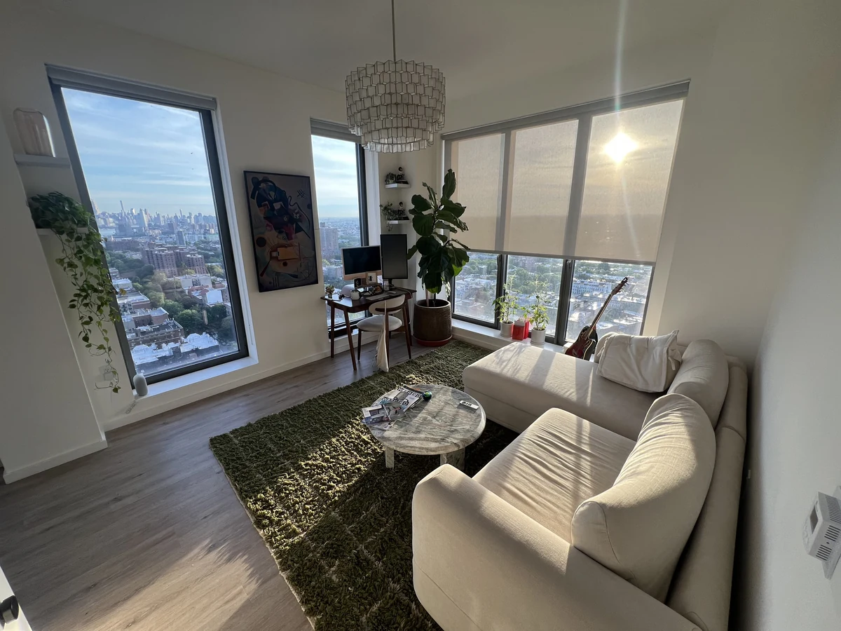 A real member's Brooklyn living room — the untouched photo she uploaded